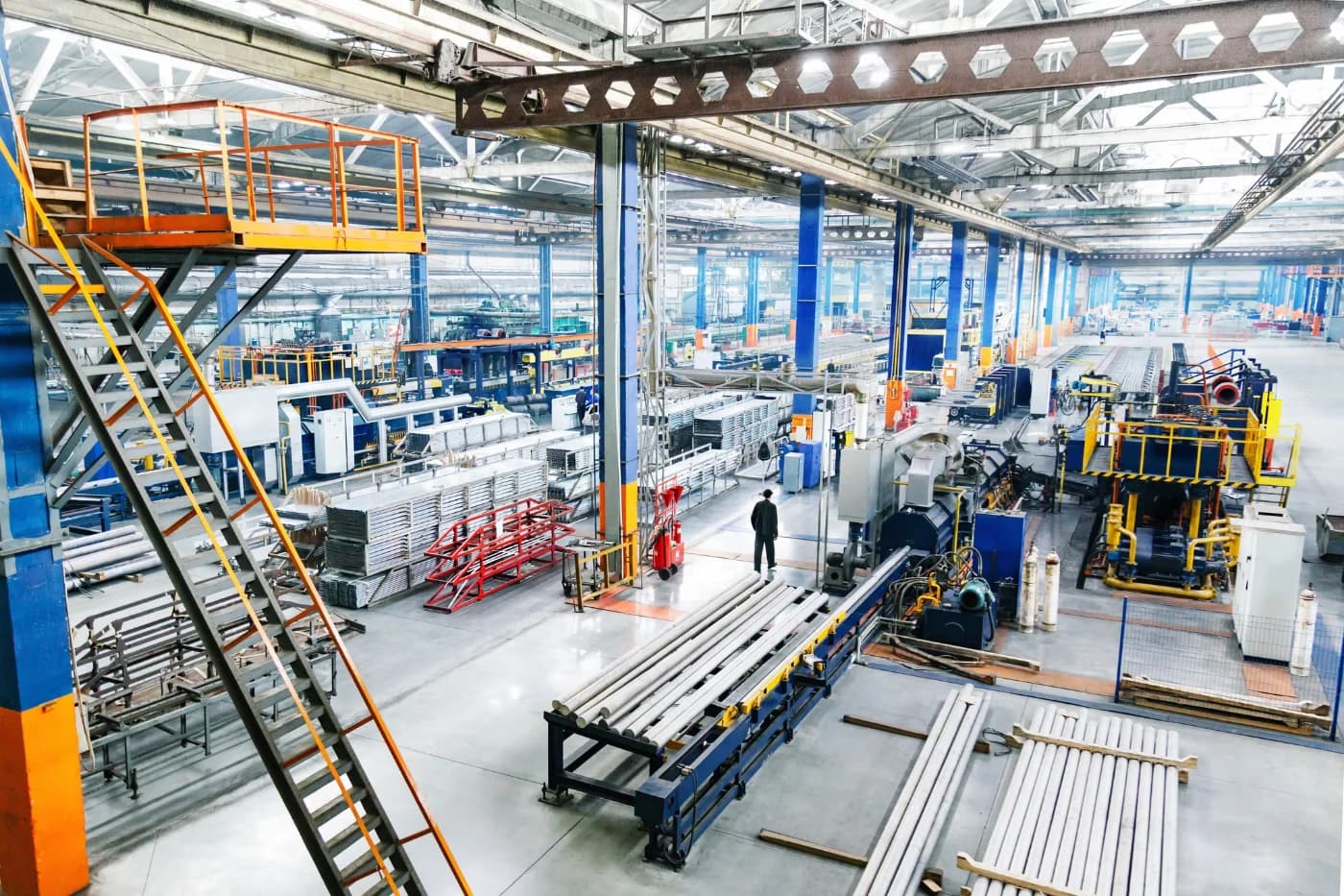 Interior of a production facility with an overhead crane rail above manufacturing lines